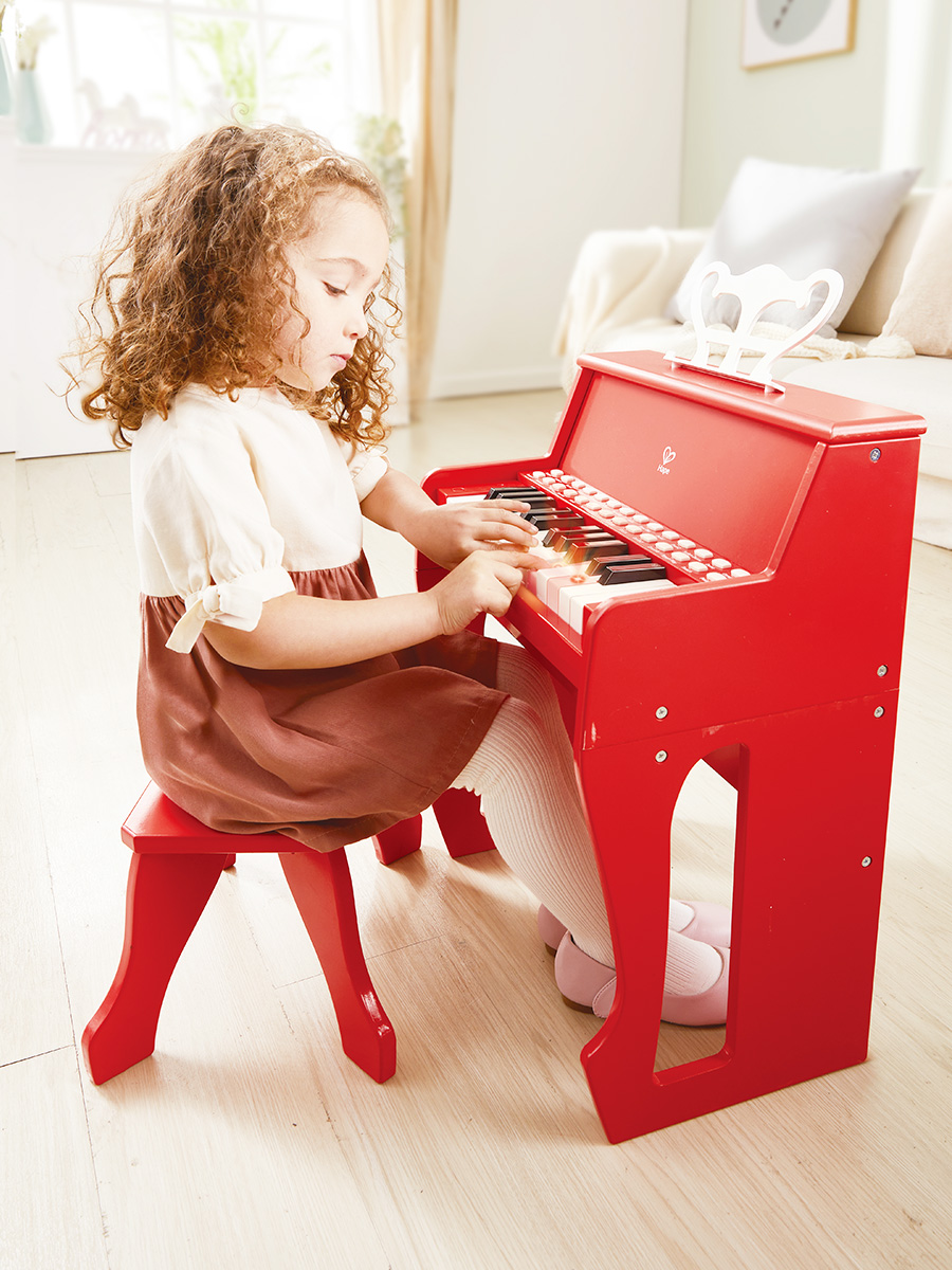Игрушка музыкальная Hape Пианино красный с табуреткой пианино - фото 4