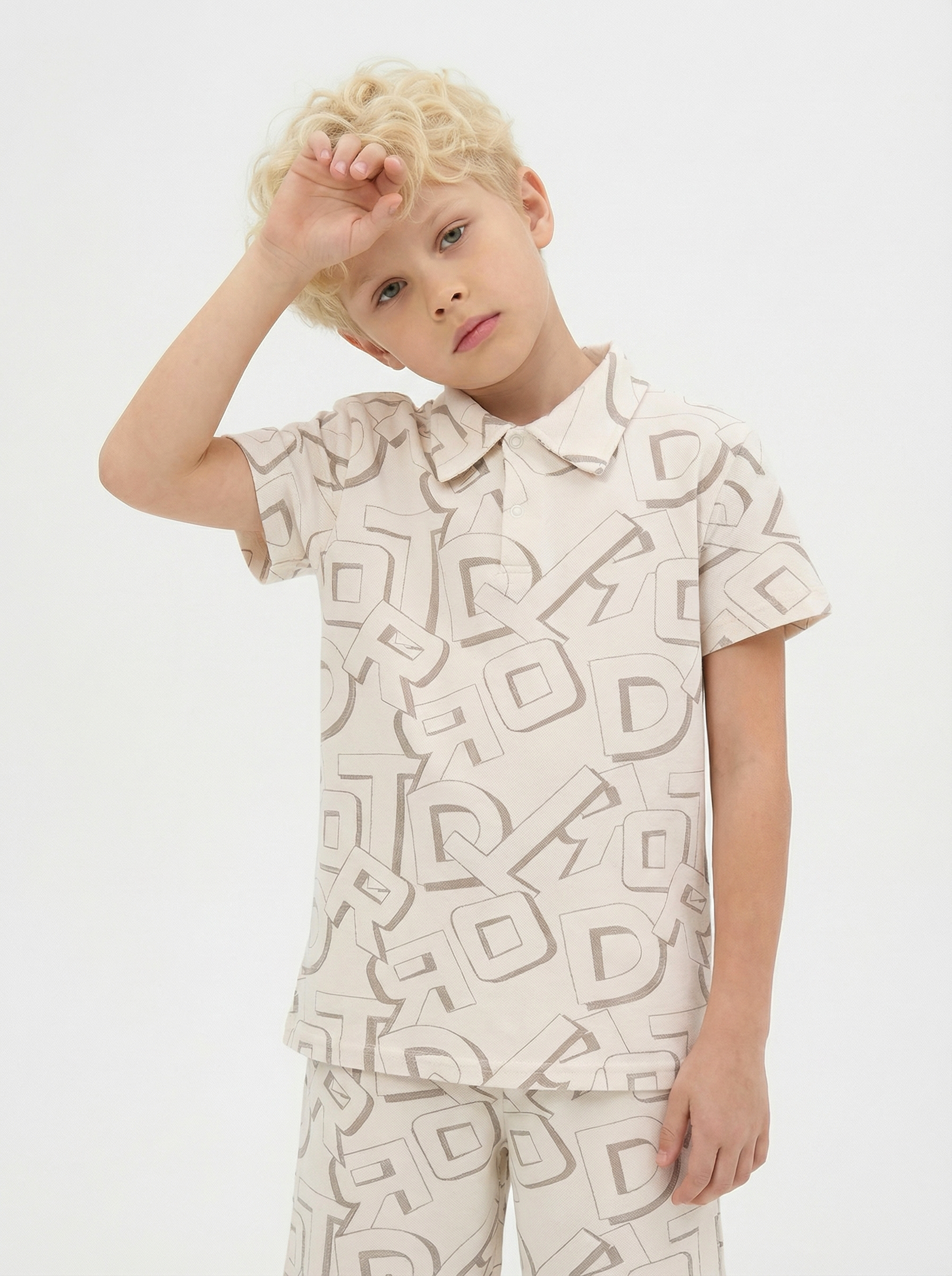 Изображение товара Комплект футболка-поло и шорты для мальчика YOULALA 158 молочный