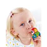 Игрушка Hape каталка Свистящий попугайчик