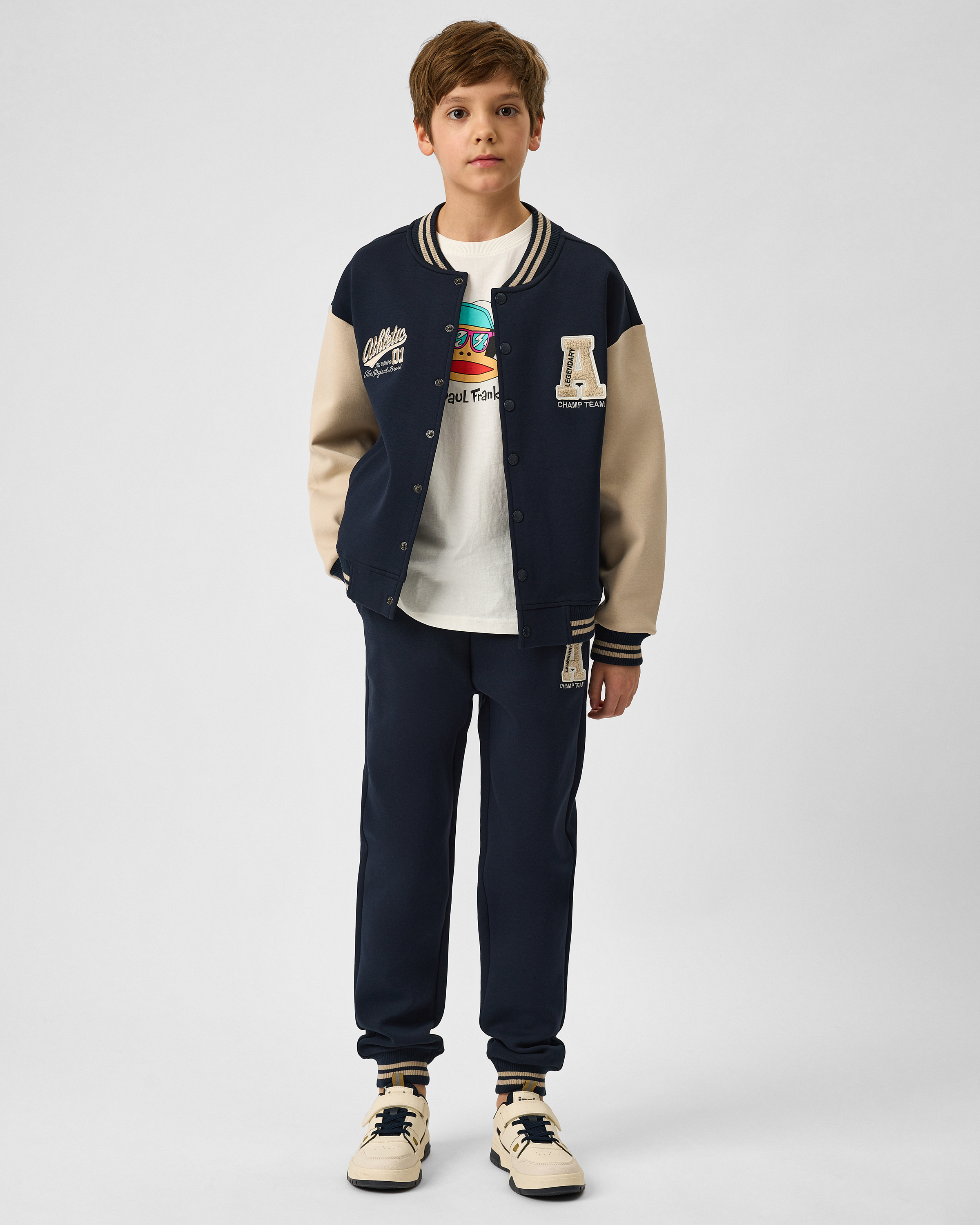 Изображение товара Детские брюки Futurino 146 тёмно-синие с нашивкой и эластичным поясом