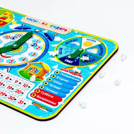 Игрушка WOODLANDTOYS бизиборд Часы-календарь